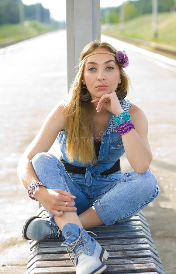 Vertical Portrait Of A Pensive Long-haired Blonde At A Bus Stop Stock ...