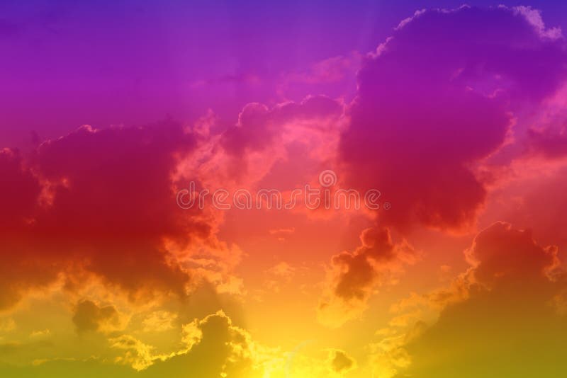Lovely bright sunset or sunrise partially cloudy sky for using in design as background. Pretty colorful sunset or sunrise clouds on the sky for using as background in design