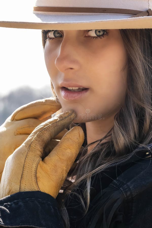 Lovely Brunette Cowgirl Enjoying A Day On Her Farm Before Riding Her