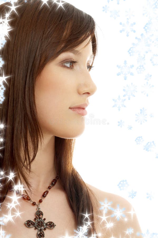 Lovely brunette with cross and snowflakes