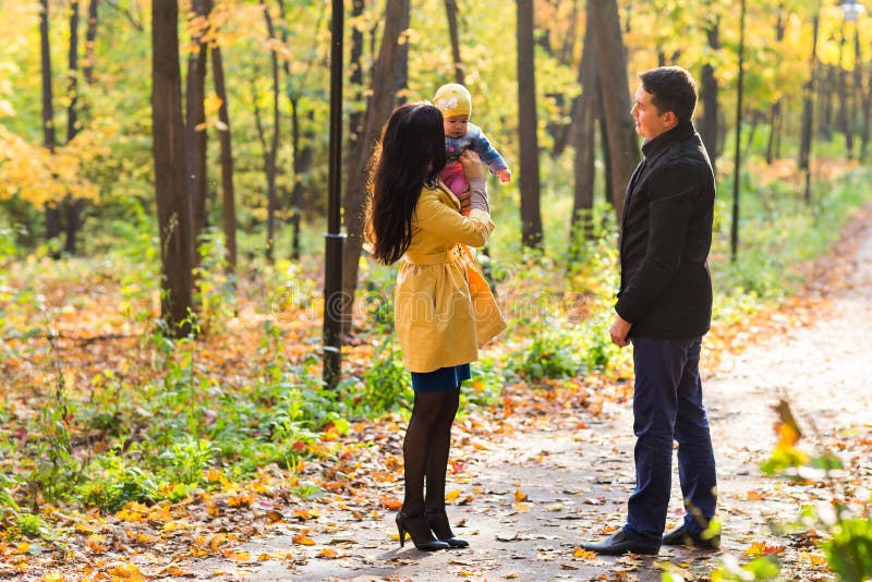 Lovely family walking in the autumn forest. Healthy lifestyle