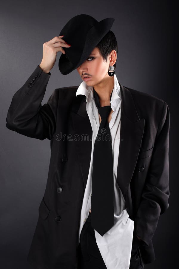 Lovely fashion model in big man shirt and coat