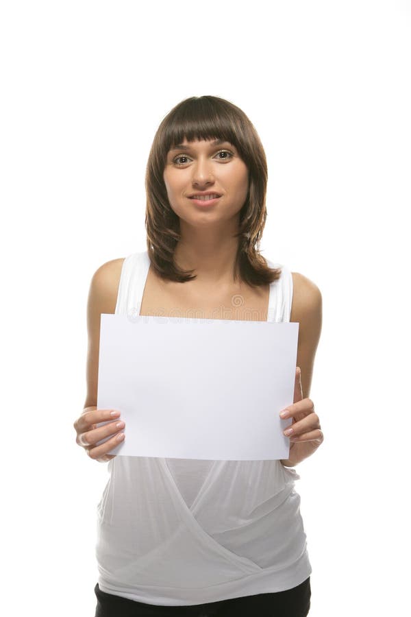 Lovely girl holding blank sign board over white.