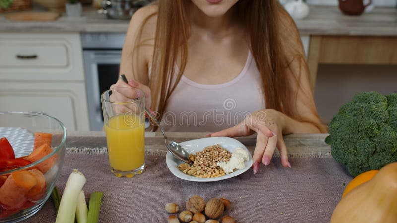 Lovely Girl Eating Raw Sprouts Buckwheat with Nuts in Kitchen with Fresh  Vegetables and Fruits Stock Photo - Image of diet, fitness: 199344132