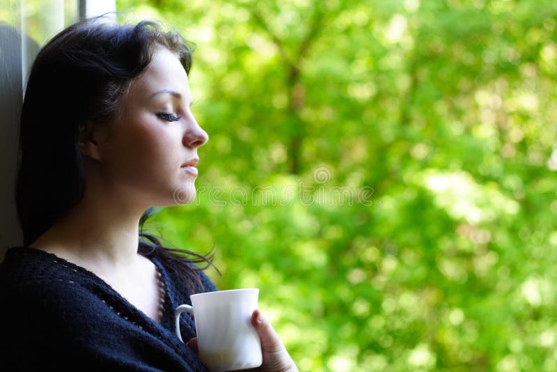 Lovely girl with a mug of coffee