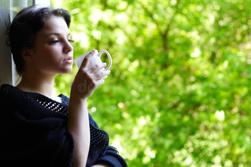 Lovely girl with a mug of coffee