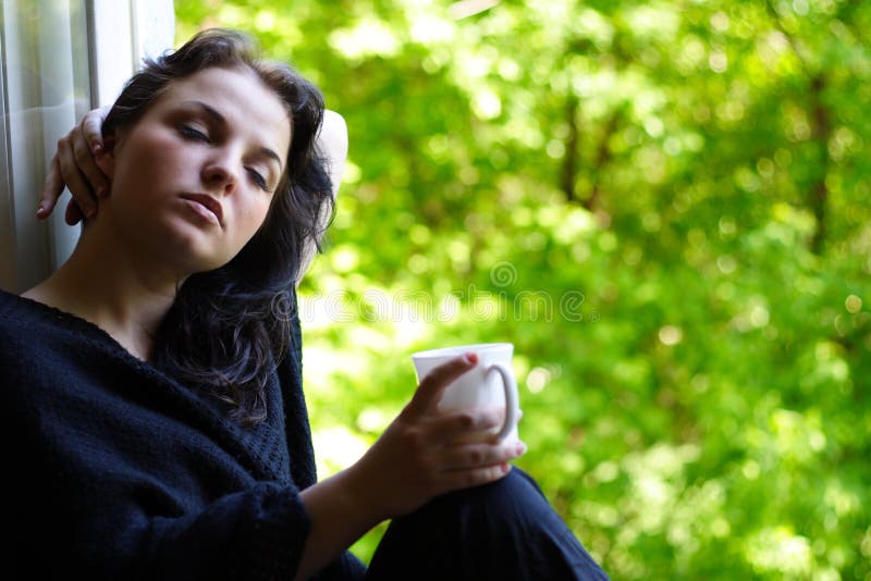 Lovely girl with a mug of coffee