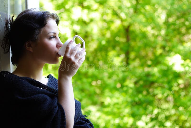 Lovely girl with a mug of coffee