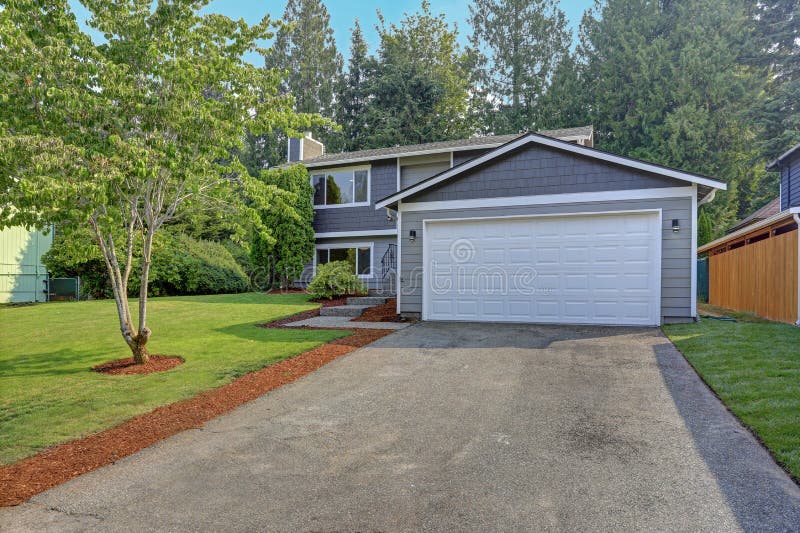 Lovely grey rambler house exterior features grey siding