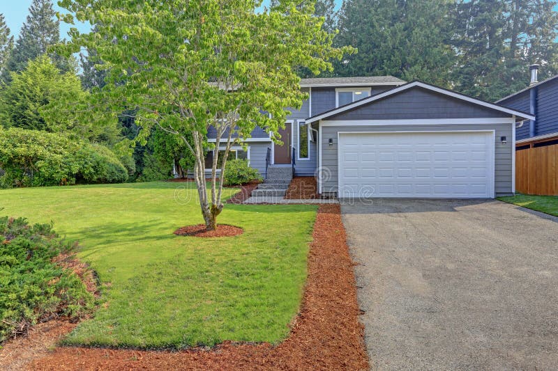 Lovely grey rambler house exterior features grey siding