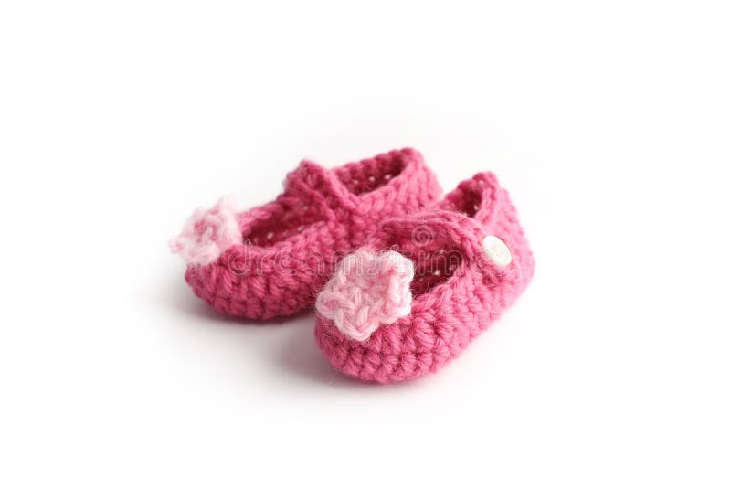 Lovely handmade cute baby red shoes with pink flower made by wool stock photography Lovely handmade cute baby red shoes with pink flower made by wool stock photography