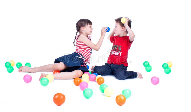 A lovely kids are playing with balls