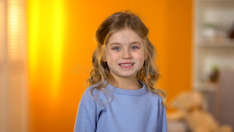 Lovely little girl showing healthy teeth to camera child dentistry and oral care stock photo Lovely little girl showing healthy teeth to camera child dentistry and oral care stock photo