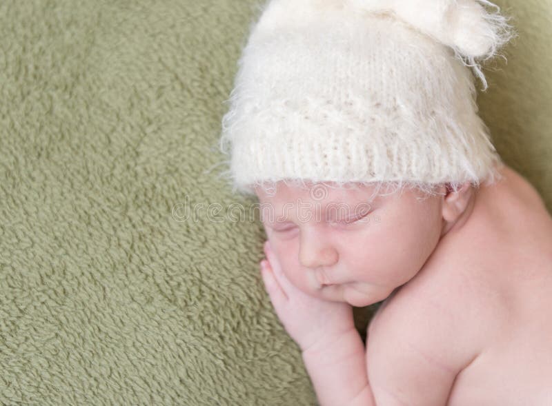 Lovely newborn baby in knitted hat