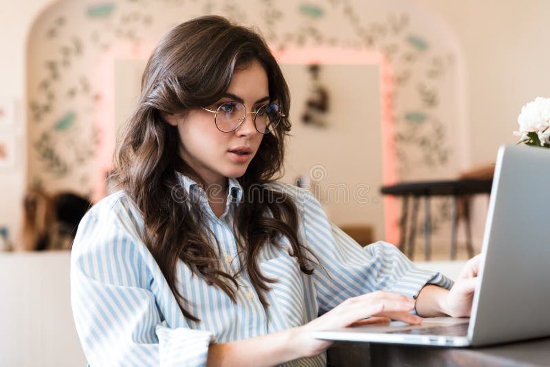 Lovely Young Brunette Woman Sitting at the Cafe Table Stock Im Lovely Young Brunette Woman Sitting at the Cafe Table Stock Im