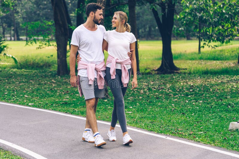 Lover Couple Holding Together and Walking in the Park Stock Photo Image of lover, sport 149437322