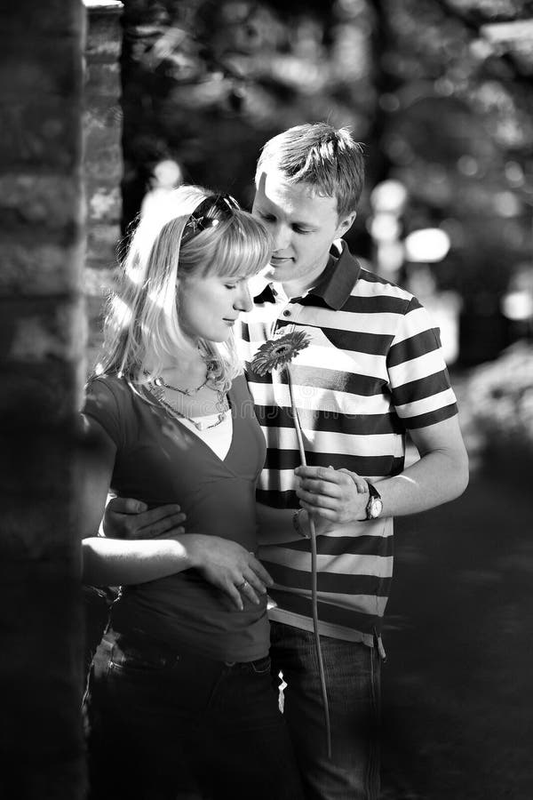 Lovers man and woman in romantic date in park