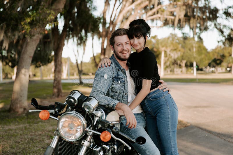Loving Adorable Portrait of two Attractive Good Looking Young Adult Modern Fashionable People Guy Girl Couple Kissing and Hugging stock photography Loving Adorable Portrait of two Attractive Good Looking Young Adult Modern Fashionable People Guy Girl Couple Kissing and Hugging stock photography