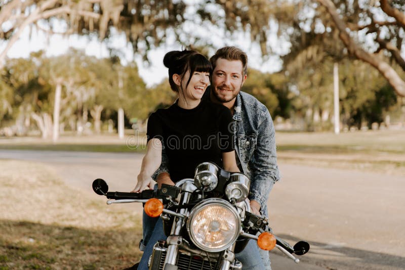 Loving Adorable Portrait of two Attractive Good Looking Young Adult Modern Fashionable People Guy Girl Couple Kissing and Hugging stock photo Loving Adorable Portrait of two Attractive Good Looking Young Adult Modern Fashionable People Guy Girl Couple Kissing and Hugging stock photo