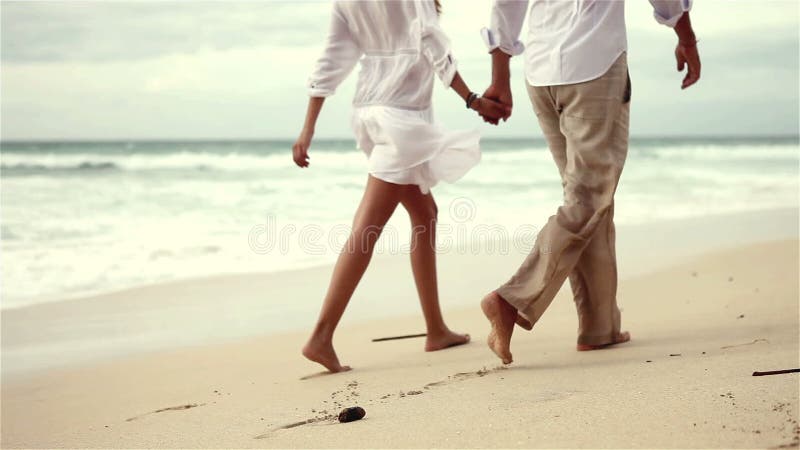 Loving couple on beach in slow motion stock video footage