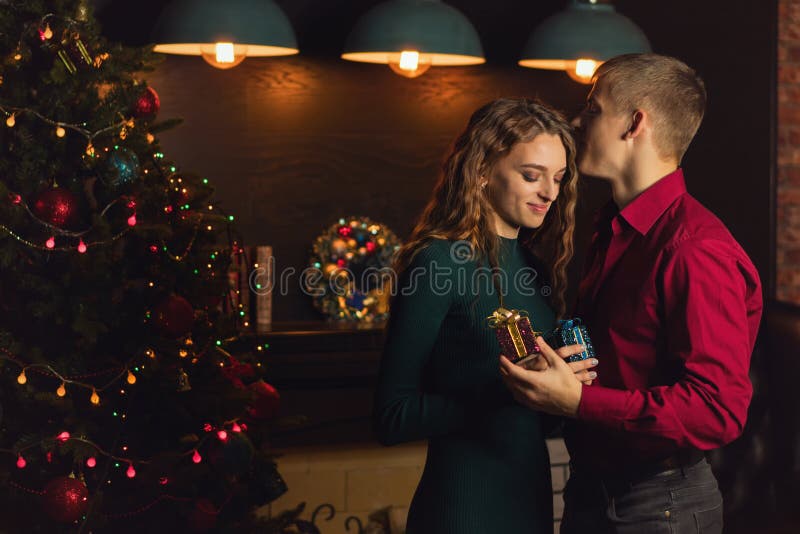 A loving couple celebrates Christmas stock images A loving couple celebrates Christmas stock images
