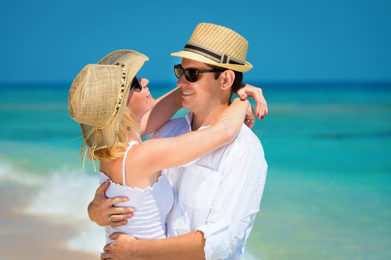 Loving couple on a clean blue sea royalty free stock photos Loving couple on a clean blue sea royalty free stock photos
