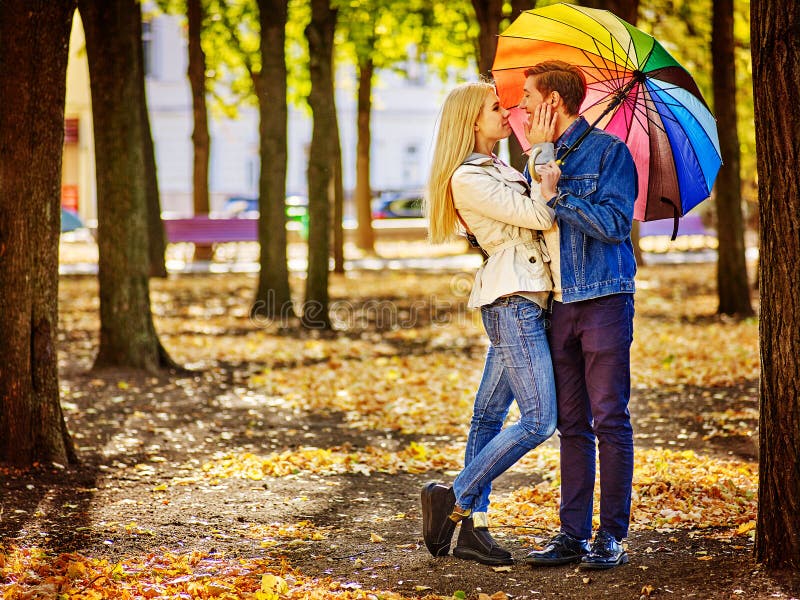 Loving couple full height on a date kissing under stock images Loving couple full height on a date kissing under stock images