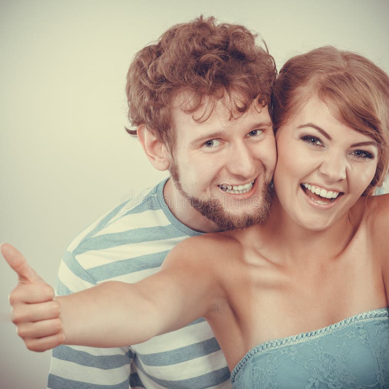 Loving couple girl holds thumb up gesture royalty free stock image Loving couple girl holds thumb up gesture royalty free stock image