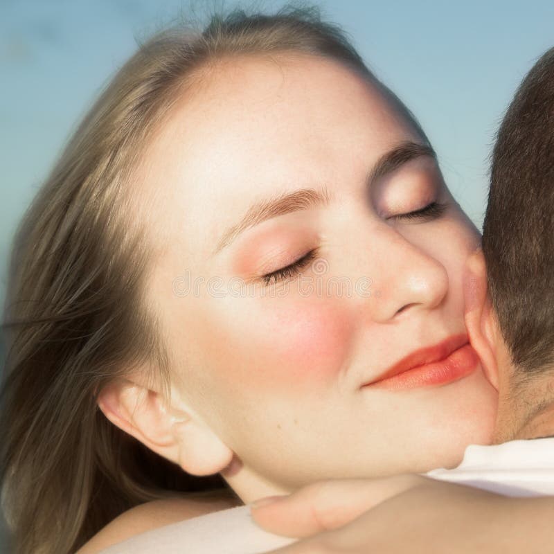 Loving couple hugging with focus on woman s face