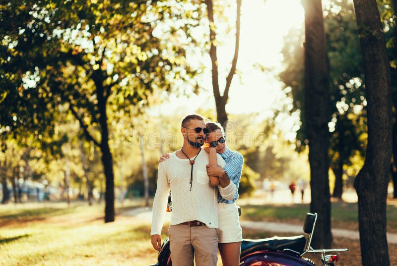 Loving couple hugging on sunset stock photo Loving couple hugging on sunset stock photo