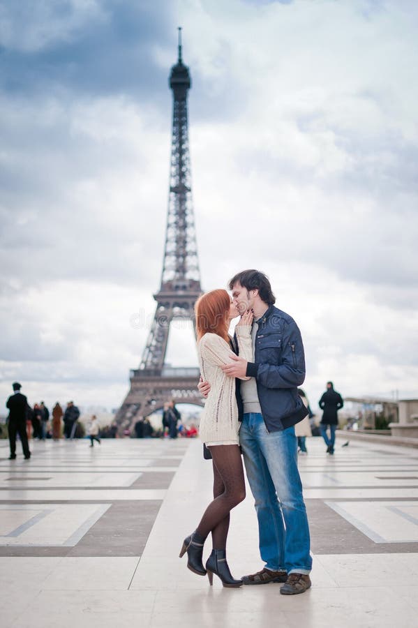 Loving Couple Kissing Near the Eiffel Tower in Paris Stock Image