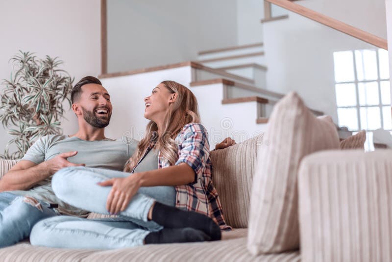 Loving couple relaxing on the couch on a free evening