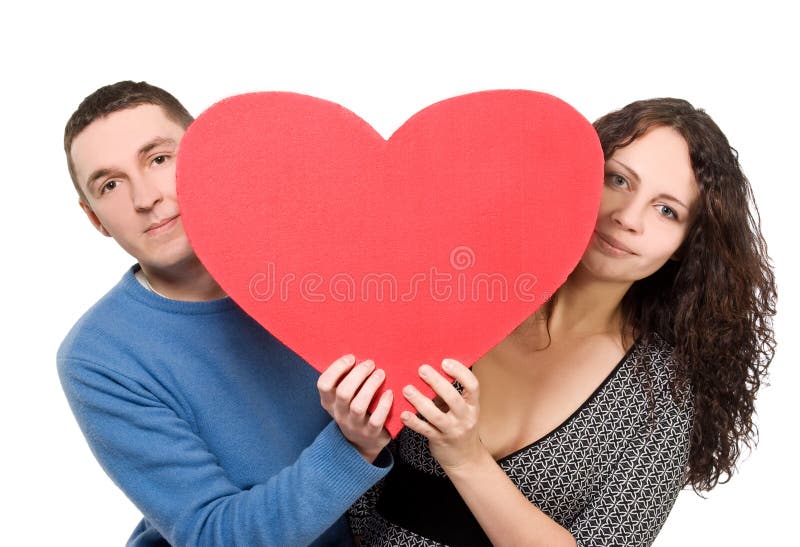 Loving couple tenderly holding heart