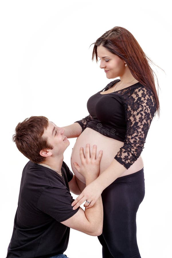 Loving happy couple, smiling pregnant woman with her husband