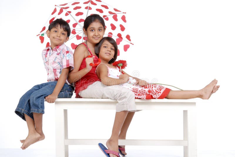 Loving indian twins with elder sister stock photography Loving indian twins with elder sister stock photography