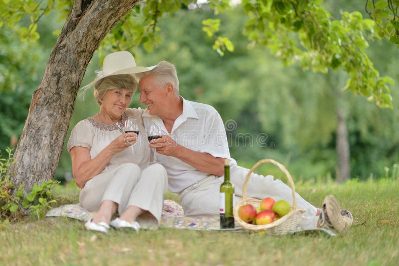 Loving Mature Couple Spends Time Together In The Summer Outdoors Stock