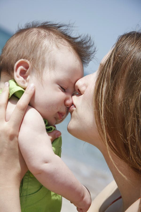 Loving mother and baby on nature