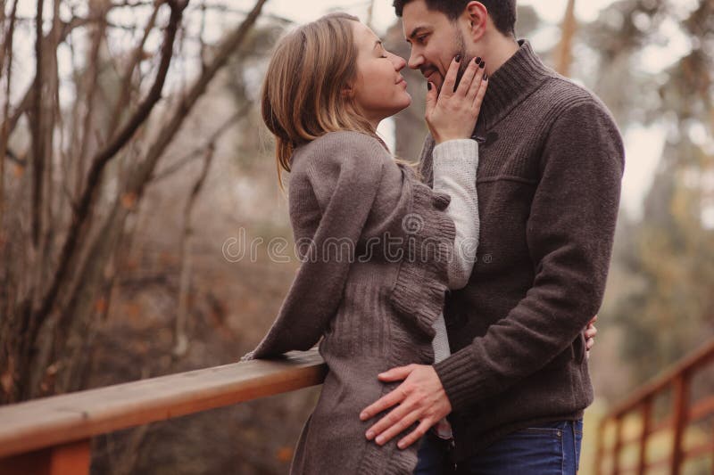 Loving young couple happy together outdoor on cozy warm walk in autumn forest royalty free stock image Loving young couple happy together outdoor on cozy warm walk in autumn forest royalty free stock image