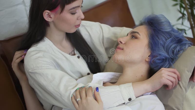 Loving Young Lesbian Couple is Caressing and Touching on Couch in Home Interior. Spbd Stock Video - Video of happiness, partner: 181310369