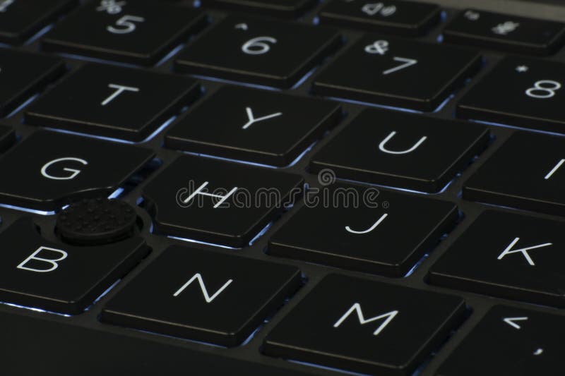 Low angle close up of laptop keyboard illumination, backlit keyboard. Low angle close up of laptop keyboard illumination, a backlit keyboard