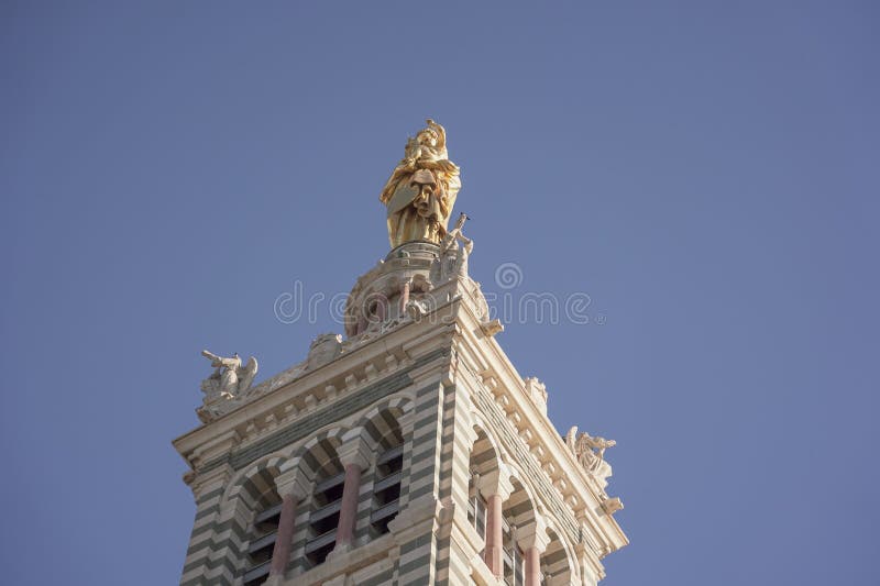 Low-angle shot of the cathedral of Notre Dame de lagarde in Marseille, France against the blue sky