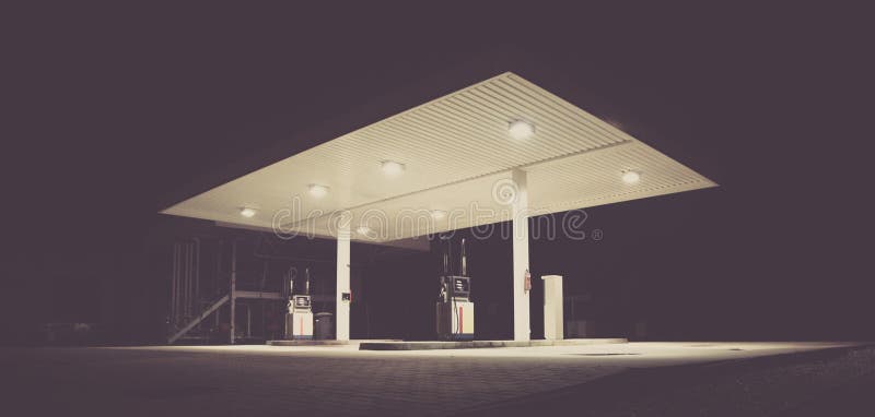 Low Angle Shot Of An Empty Gasoline Station With Lights At Night Time