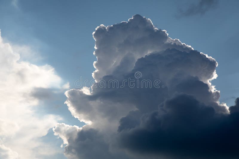 Low angle shot of a nimbus cloud with silver linings royalty free stock images