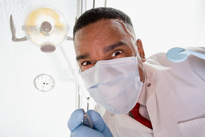 Low angle view of dentist and dental nurse stock image