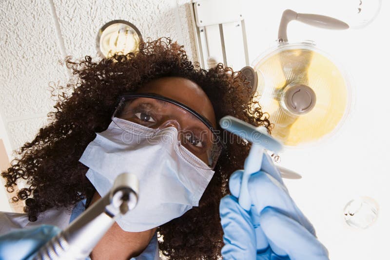 Low angle view of dentist and dental nurse royalty free stock images