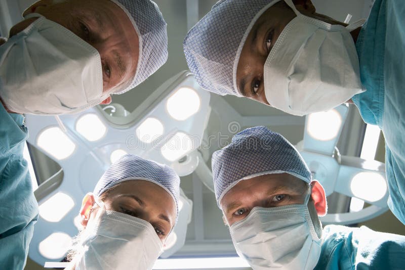 Low Angle View Of Four Surgeons stock photography