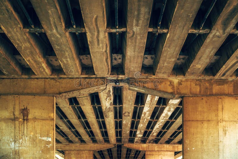 Low angle view of lower section of an old concrete bridge, example of brutalist architectural style stock images