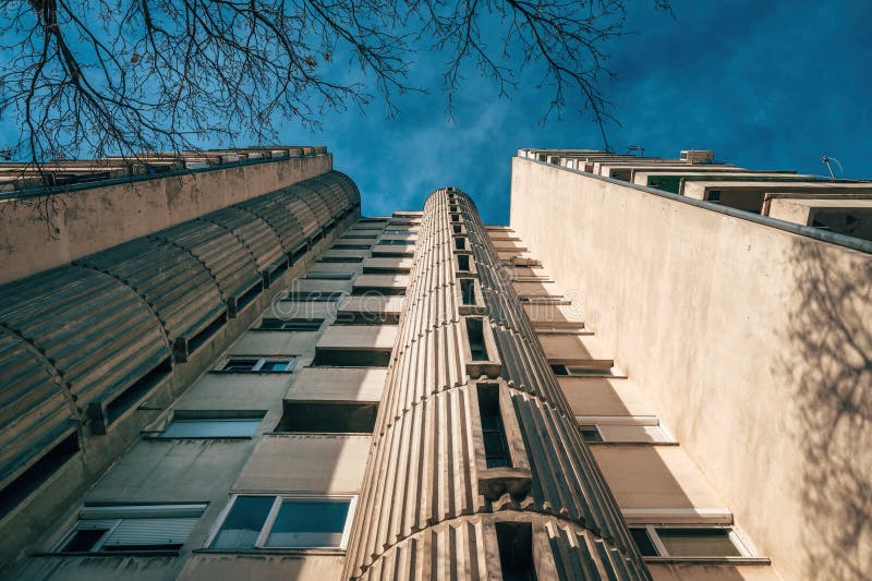 Low angle view of tall residential skyscraper building built in brutalist architectural style in 1980s in former Yugoslavia royalty free stock photos