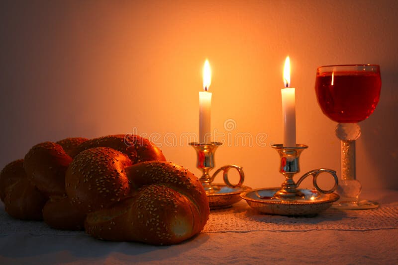 Shabbat Image. Challah Bread, Shabbat Wine and Candelas on Wooden Table