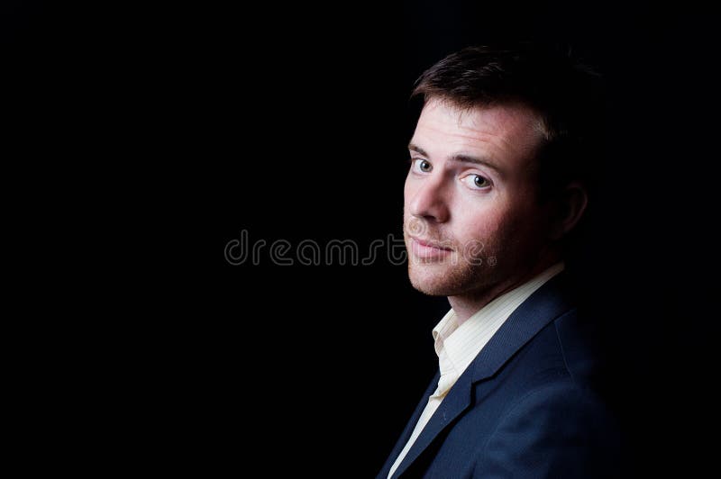 Low-key studio portrait of a business man stock image